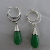 A pair of silver and jade earrings