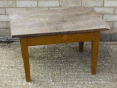 A 19th century elm topped coffee table