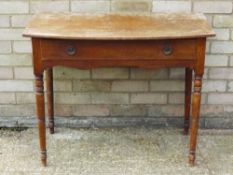 A Victorian mahogany bow fronted single drawer side table