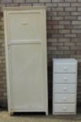 A white painted cupboard and a bank of drawers