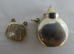 A silver gilt purse and a small scent bottle