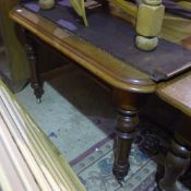 A Victorian mahogany extending dining table