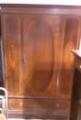 An Edwardian inlaid mahogany wardrobe