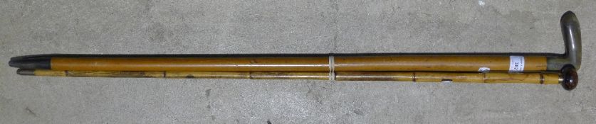 A tortoiseshell mounted walking cane and a horn handled walking stick