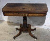 A Regency brass inlaid card table