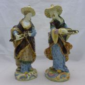 A pair of late 19th century Majolica chinoiserie figurines