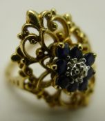 A gold and sapphire ring