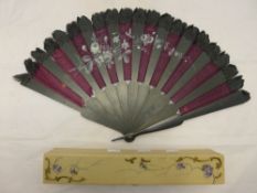 A boxed vintage fan