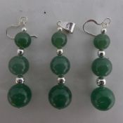 A jade and silver three piece earring and pendant set