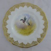 A Cauldon porcelain cabinet plate, decorated by D.