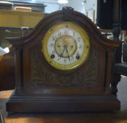 A late Victorian walnut mantle clock