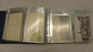 A postcard album of 124, mainly Edwardian cards,