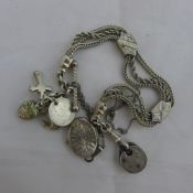 A silver watch chain and pendant on chain