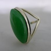 A silver and jade ring