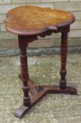 A Victorian oak trefoil side table