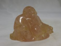 A rose quartz Buddha