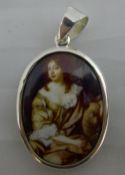 A miniature silver portrait pendant