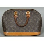 A vintage Louis Vuitton handbag Stamped Louis Vuitton, Paris, Made in France and numbered TH1919.