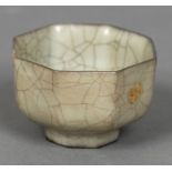 A Chinese Guan porcelain crackle glaze tea bowl Of octagonal section, standing on a shallow foot,