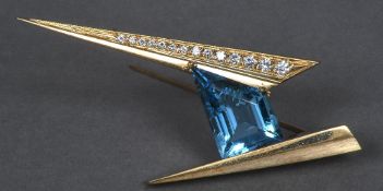 A contemporary 14 K gold aquamarine and diamond set brooch Of angular form. 7 cm wide.