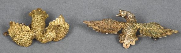 A gold filigree brooch Formed as a bird, the underside marked AS20; together with a similar example.