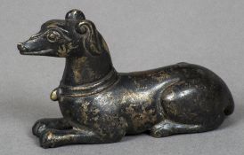 A Chinese cast bronze scroll weight Modelled as a recumbent dog. 7 cm long.