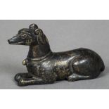 A Chinese cast bronze scroll weight Modelled as a recumbent dog. 7 cm long.