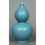 A Chinese porcelain double gourd vase With allover blue glaze,