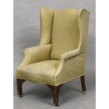 A Chippendale style mahogany upholstered wing back armchair Of typical form,