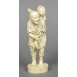A late 19th/early 20th century Japanese carved ivory okimono Worked as a gentleman holding his days