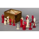 An early 19th century Chinese Export carved ivory and stained ivory chess set The white Rooks with