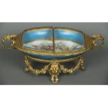 A Sevres style glass topped gilt mounted porcelain casket With double hinged top above the