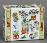A late 19th century Chinese famille rose flower brick Of typical pierced rectangular section form