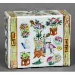 A late 19th century Chinese famille rose flower brick Of typical pierced rectangular section form