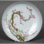 A Chinese porcelain dish The shallow bowl well painted with flowering blossom,