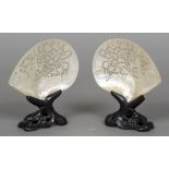 A pair of late 19th century Canton carved shells Each of pierced form,