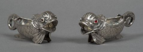 A pair of small Russian silver sauceboats Each formed as a stylised fish with cabochon set eyes,