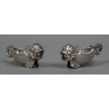 A pair of small Russian silver sauceboats Each formed as a stylised fish with cabochon set eyes,