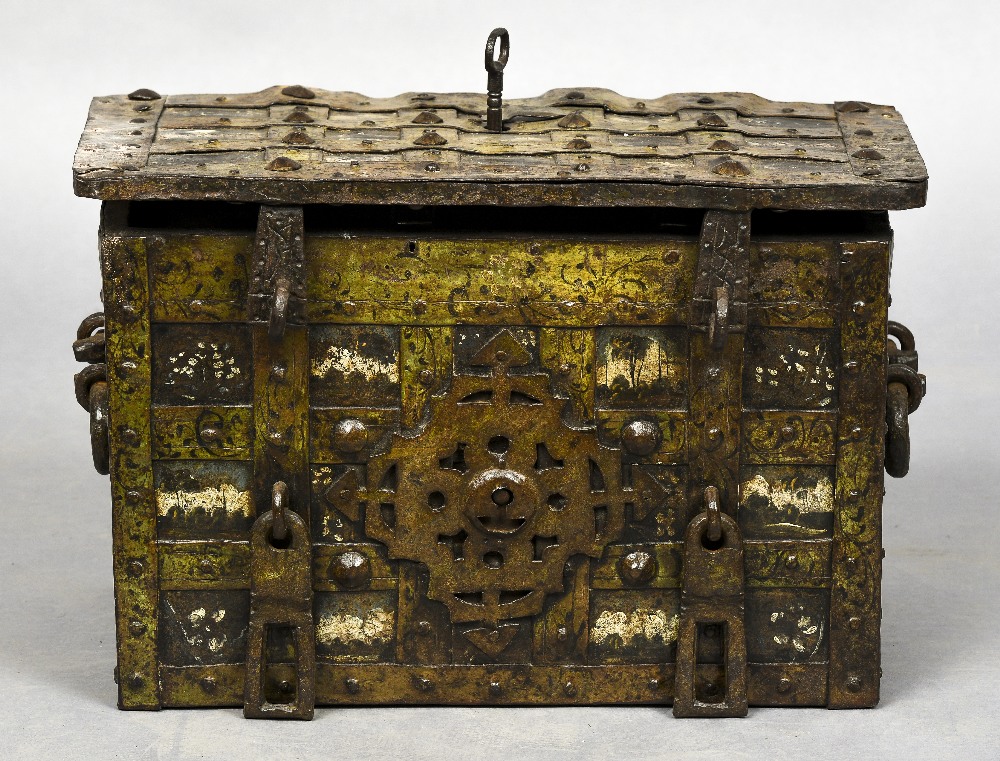 A 17th century iron bound Armada chest Of typical rectangular top locking hinged form,