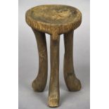A 19th/20th century Ethiopian tribal stool Of typical form. 48 cm high.