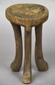 A 19th/20th century Ethiopian tribal stool Of typical form. 48 cm high.