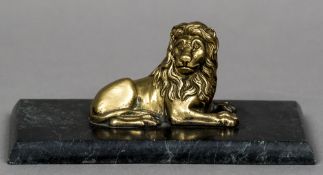 A 19th century bronze animalier paperweight Formed as a recumbent lion,