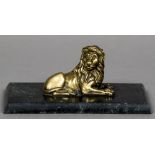 A 19th century bronze animalier paperweight Formed as a recumbent lion,