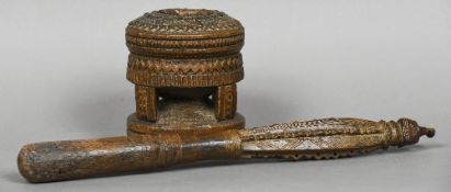 A 19th/20th century tribal African wood pestle and mortar Both worked with geometric decoration.