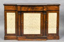 An early 19th century rosewood breakfront side cabinet The shaped top above a single frieze drawer