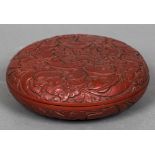 A Chinese red cinnabar lacquered box and cover Profusely worked with floral sprays. 17 cm diameter.