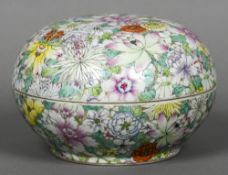 A Chinese millefiori porcelain box and cover Of circular section and typically decorated in bright