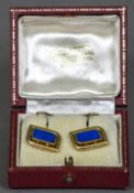 A pair of Art Deco 18 ct gold lapis set cufflinks Each of pierced rounded rectangular form. Each 1.