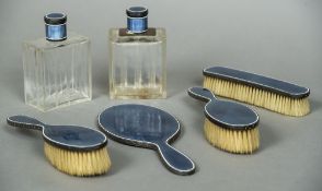 A French guilloche enamel decorated silver six piece dressing table set Comprising: hand mirror,
