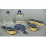 A French guilloche enamel decorated silver six piece dressing table set Comprising: hand mirror,